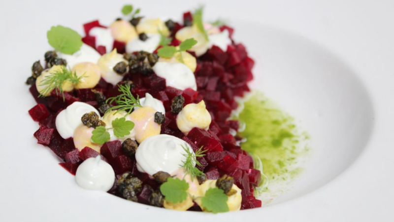 Beet tartare with whipped goats cheese, popped capers and dill oil.